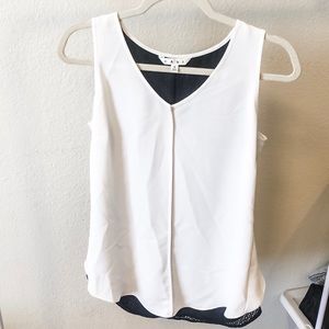 White CAbi top with black lining